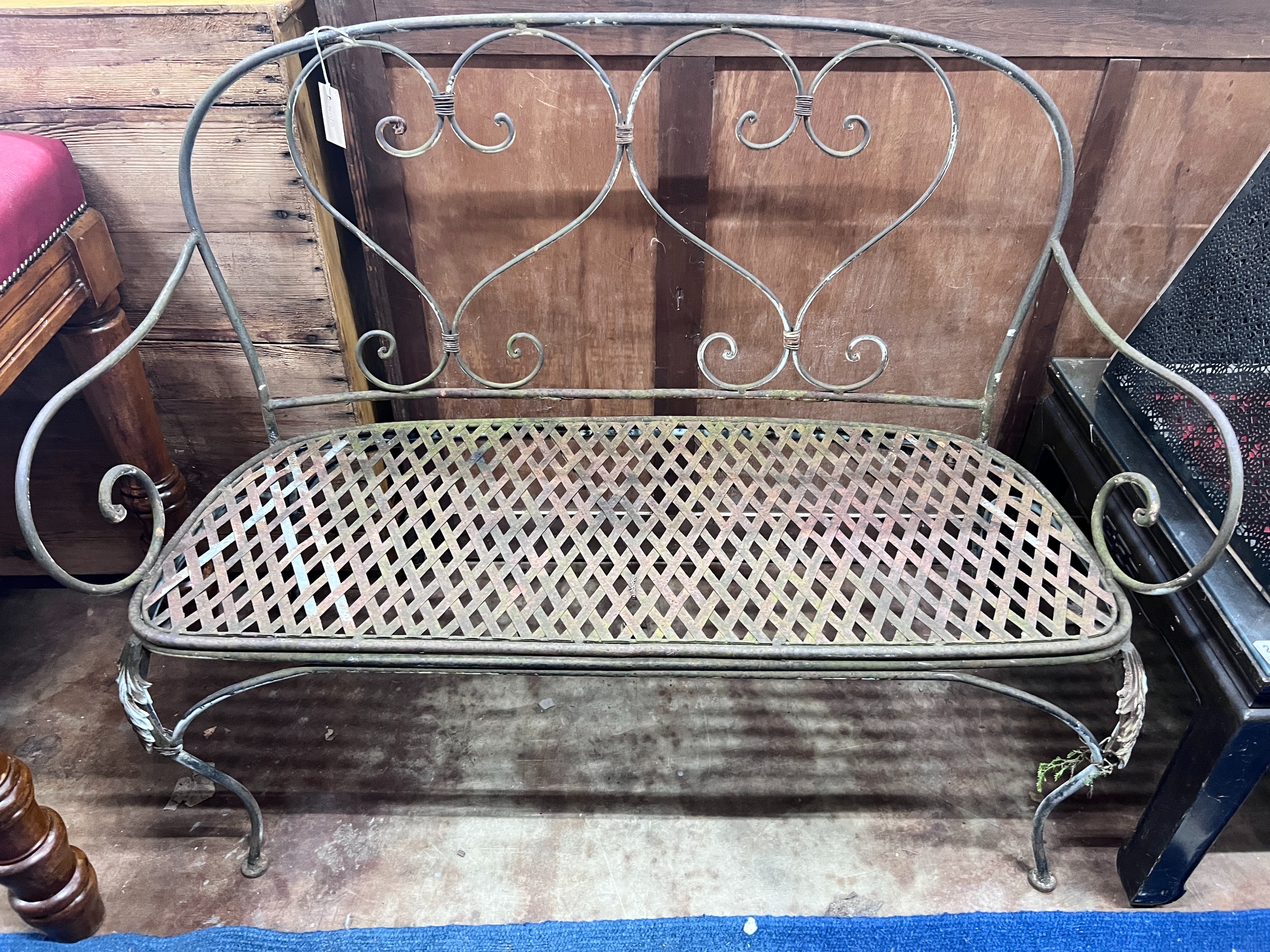 A wrought iron garden bench, width 120cm *Please note the sale commences at 9am.